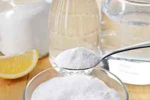  Pouring baking soda down the garbage disposal